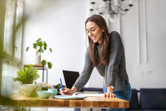 Young Female Freelancer Working In Loft Office
