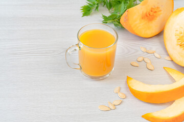Glass Cup of fresh pumpkin and carrot juice