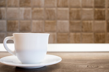 cup of coffee on wooden background