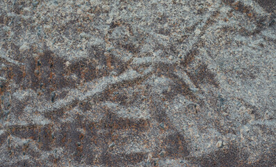 The surface of old metal objects that are rusty and black stained