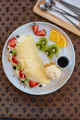 Cold crepes, vanilla ice cream with crepes and strawberry, sweet and desserts