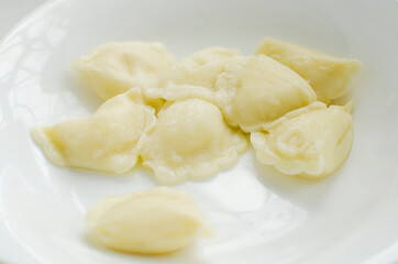 Dumplings with potatoes, close-up. Traditional Russian dish - dumplings