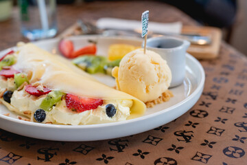 Cold crepes, vanilla ice cream with crepes and strawberry, sweet and desserts