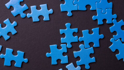 blue puzzle pieces on colored background