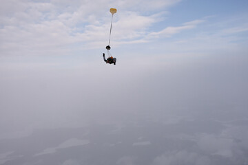 Naklejka na ściany i meble Skydiving. A parachute deployment. The finish of freefalling.