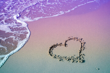 Sea coast. Inscription heart on beach sand