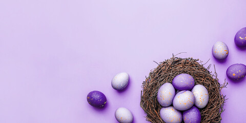 Easter eggs in nest on purple background. Flat lay, top view.