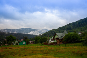 Mountains landscapes hiking trails wilderness forest fields and flowers farm car road haystacks Carpathians