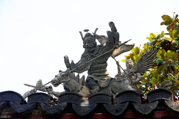 Fototapeta premium Ancient architecture sculpture on the roof in Yu Garden,Shanghai,China