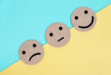 Smiley face, neutral face and sad face. Service rating concept.