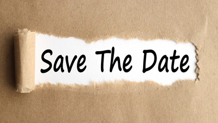 save the date, text on white paper on torn paper background