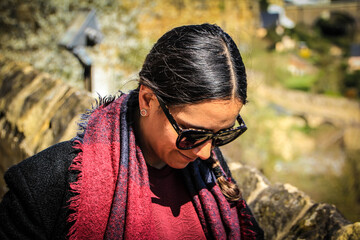 latin girl with sunglasses and red dress