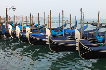 Venice, Italy - Winter 2020: empty gondolas stopped at the city center dock