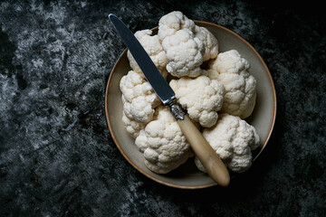 Raw Cauliflower over a metal background