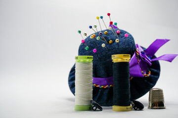 Fototapeta na wymiar Bespoke pincushion designs in the shape of hats for dressmaking and sewing craft