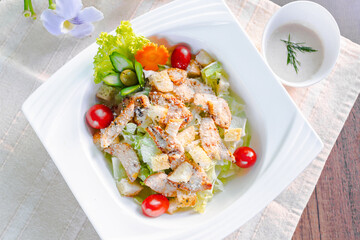 caesar salad on table.