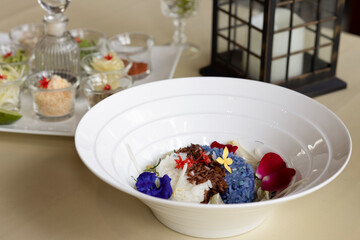 Southern Thai style fruits and vegetables salad or Khao Yam placed on fine crystal wares.