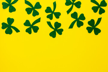 Composition for St. Patrick's Day. Decorating paper with green clover or shamrocks and gold coins