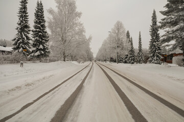 Fototapeta premium Winter road in a small town