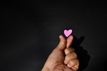 Hands holding a mini heart valentines day