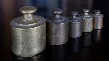 A vintage brass standard weight set. Metal weights to determine weight. Calibration weights....
