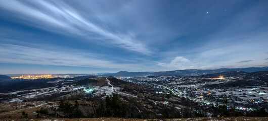 Night view of village in mountains during winter