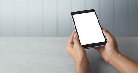 Hands holding  tablet touch computer gadget with  screen