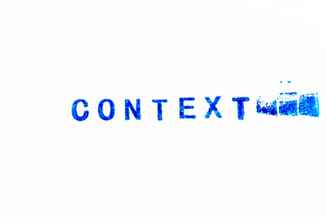 Blue color ink of rubber stamp in word context on white paper background