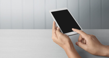 Hands holding  tablet touch computer gadget with  screen