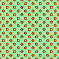 Cookies template with sesame seeds on a green background. View from above. Creative design, minimal flat lay concept.