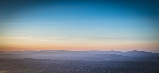 Fototapeta premium Panorama of a beautiful landscape with mountain ranges at sunset. At Khao Yai National Park Thailand