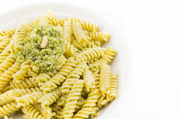 Pasta with pesto, basil leaves with white background
