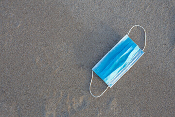 Worn Covid masks on the beach