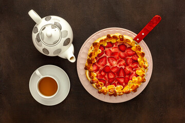 Fresh strawberry pie for breakfast with green tea