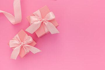 Composition of pink two gift boxes with ribbon and hearts