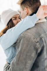 Fototapeta premium A couple walks in the winter. Couple in love. Snow. Winter.