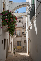 Fototapeta na wymiar Strolling through the old town of Locorotondo in Puglia Italy