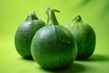 Italian pumpkin on green background