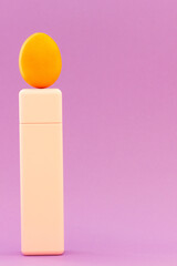 Creative idea. red egg standing on a pink geometric shape. The concept of balance