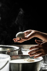 A cheesemaker prepares a form of mozzarella cheese silano or caciocavallo in the Italian tradition with pure milk and excellent quality cheese