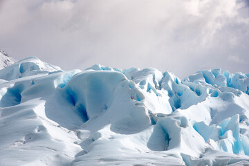 Fototapeta na wymiar Glacier Perito Moreno, ice, snow, windy, could