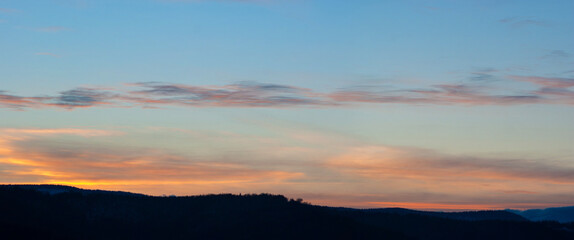Clouds at sunset in winter in the mountains