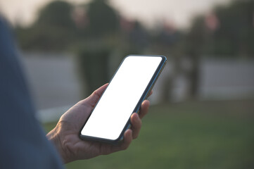 Mockup image with blank screen.Close up of women's hand holding and use smartphone for social network,messaging or shopping online.Happy people with technology business concept.