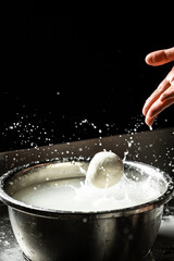 Cheesemaker preparing fresh cheese. The homemade cheese maker produces caciocavallo. Pasta filata, Traditional Italian mozzarella