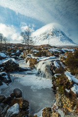 the majestic buachaille etive mor on rannoch moor and glencoe in the argyll region of the highlands of scotland during a snow storm in winter