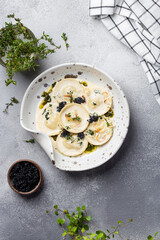 ravioli with mushroom, cream sauce and cheese
