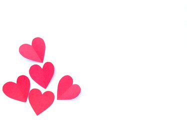 Red hearts paper on white background for Valentines day. Top view with copy space.