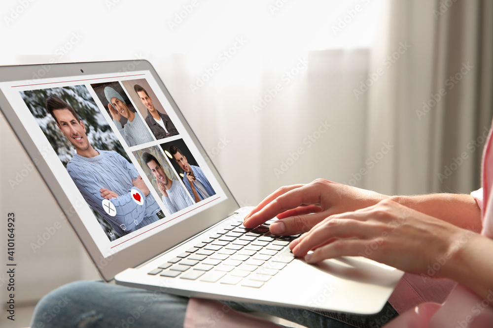 Poster Woman visiting dating site via laptop indoors, closeup