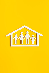 Wooden family figure in house. Stay at home concept