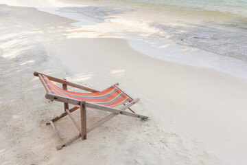 Fototapeta na wymiar Empty beach chair on the beach